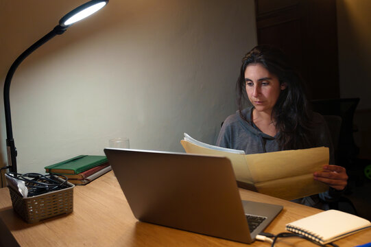 Woman Working Late on Laptop
