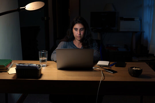 Woman Working Late on Laptop