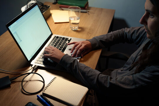 Woman Working Late on Laptop