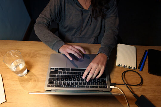 Woman Working Late on Laptop