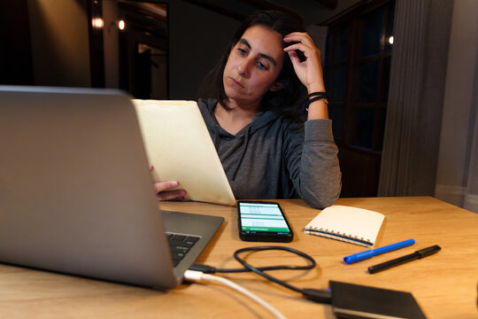 Tired Woman Working Late on Laptop at Night at Home