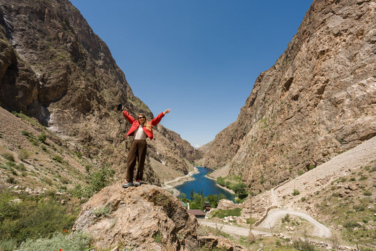 Woman Stands on a Rock in Haft Kul region, Tajikistan