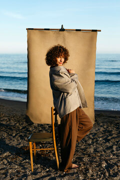 Woman posing outdoor studio set on beach