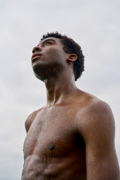 Young Man Looks up at the Sky During a Sunny Day