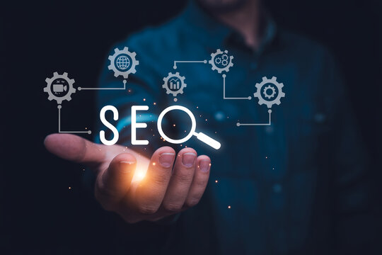 SEO optimization concept with magnifying glass and gears displayed on open hand.