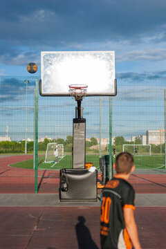 Basketball court with player, flying ball