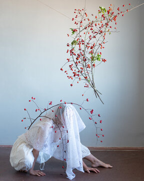 Woman under the veil with plants