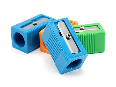 Colorful plastic pencil sharpeners with metal blades arranged together