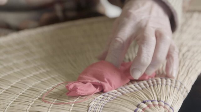 Elderly Hands Sewing Decorations on Bon Odori Hat in Ugo Town Akita Ja