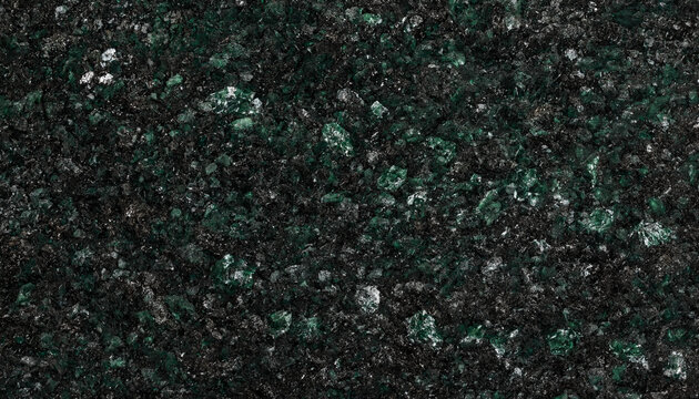 Dark green and black granite stone texture with shimmering crystalline mineral flecks and deep emerald tones in a polished rock surface slab