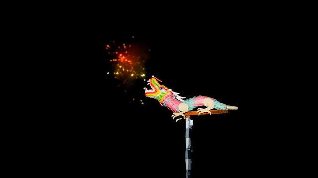 Colorful traditional Chinese paper dragon toy on a stick with fireworks exploding in the dark night sky background.