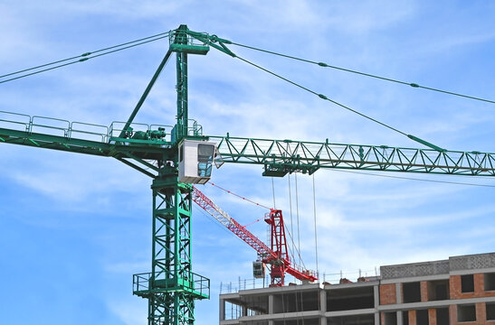 Building construction site with two cranes