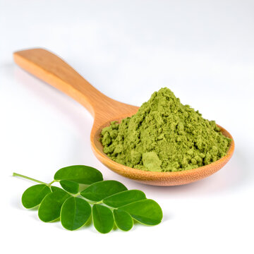 Moringa leaves powder with green moringa leaf on white background