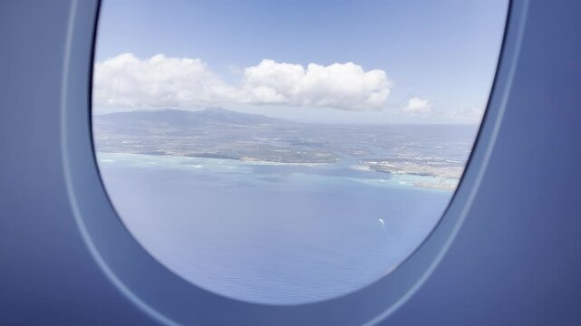 In the distance are Pearl Harbor and the airport runway.  Flights from Daniel K. Inouye International Airport in Honolulu, Oahu, Hawaii, to Narita Airport in Tokyo, Japan. The Airbus A380 