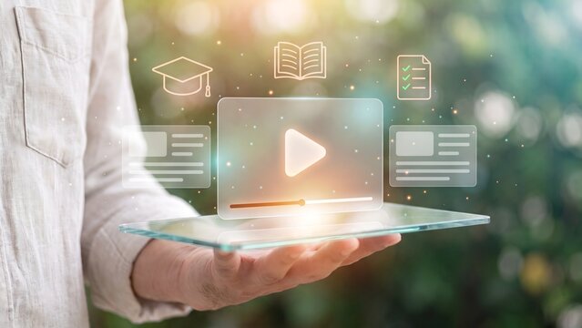 Online video learning and e-learning webinar course for digital education concept. Hand holding tablet with video play button, graduation cap, book and checklist icon for training platform