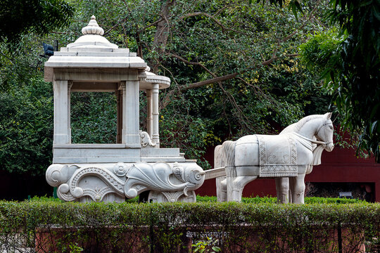 Delhi, India - 20 February, 2026: White Marble Horse and Chariot Sculpture at Birla Mandir Delhi