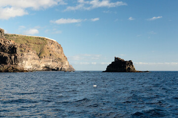 Fototapeta premium Volcanic sea stack and clifftop settlement on the coast of La Gomera Canary Islands Spain