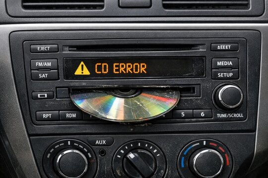 A compact car's interior showing a CD player in the center console, useful for automotive or music-related concepts