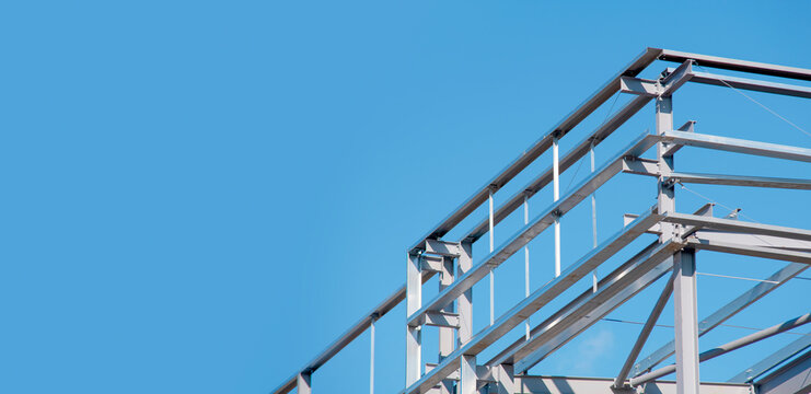 Construction work in a building site under a clear sky in a city