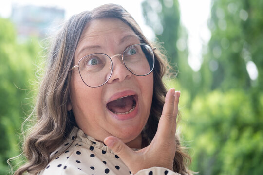 close up portrait shocked mature woman with bulging eyes, surprised facial exaggerated expression, emotional reaction, disbelief, astonishment, surprise and disbelief humor, unexpected discovery