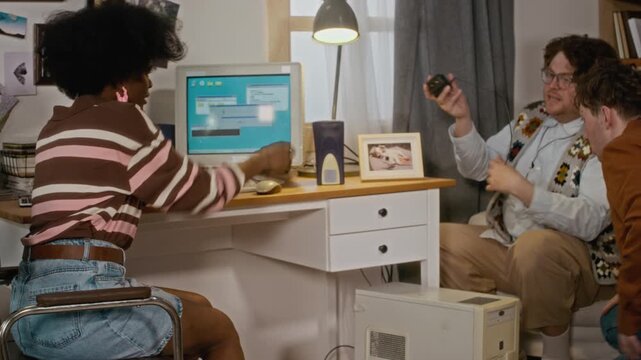 Diverse young adults, including African American woman and Caucasian men, setting up retro computer. Perfect for nostalgia-themed marketing or diversity in tech campaigns