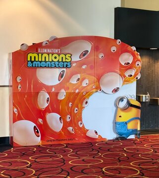 Spokane, WA - USA - July 19, 2026 - Stand - up display advertisement for the Minions & Monsters movie