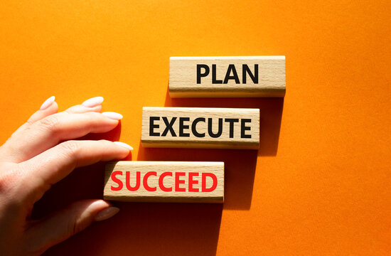 Concept words plan execute succeed on wooden blocks arranged as steps. Businessman hand arranging wooden blocks. Achievement and productivity concept. Orange background. Copy space.