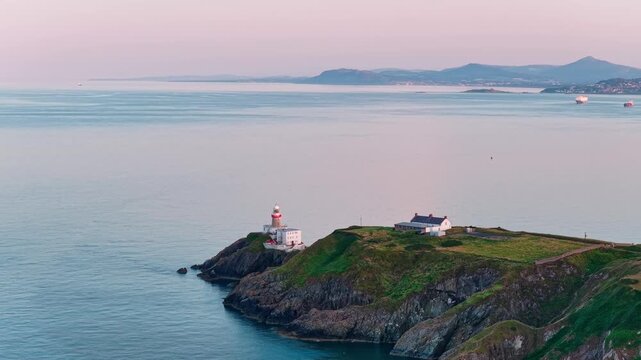 aerial 4k footage of Howth Head Lighthouse during sunset, Dublin Ireland