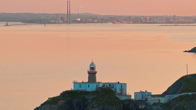 aerial 4k footage of Howth Head Lighthouse during sunset, Dublin Ireland
