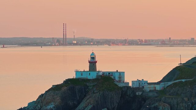 aerial 4k footage of Howth Head Lighthouse during sunset, Dublin Ireland