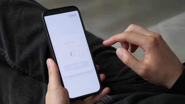 User preparing to rate a service on a clean, white mobile interface. The Send Feedback button is ready to be tapped. Ideal for minimalist app design, simple feedback forms, and modern UI stock footage