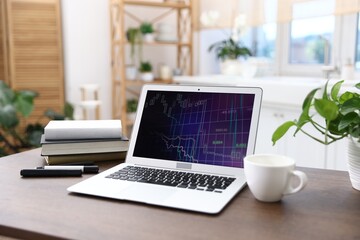 Fototapeta premium Comfortable workplace with laptop on wooden table indoors