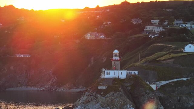 aerial 4k footage of Howth Head Lighthouse during sunset, Dublin Ireland