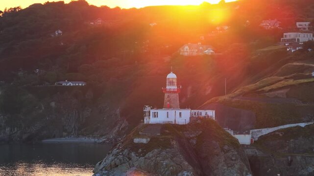 aerial 4k footage of Howth Head Lighthouse during sunset, Dublin Ireland