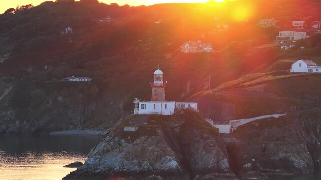 aerial 4k footage of Howth Head Lighthouse during sunset, Dublin Ireland