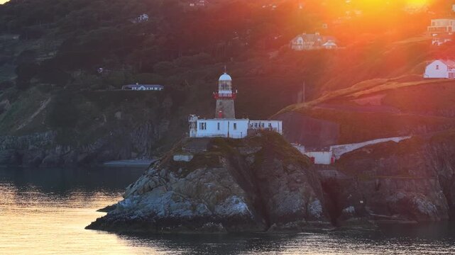 aerial 4k footage of Howth Head Lighthouse during sunset, Dublin Ireland