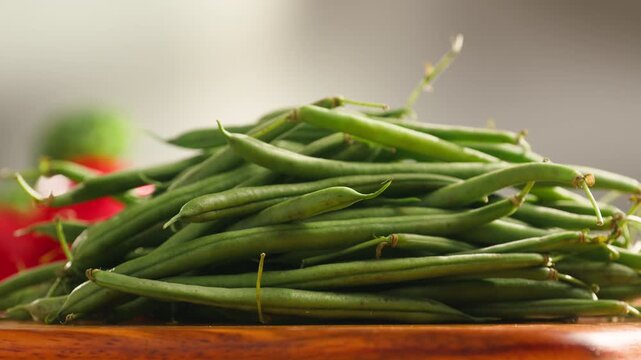 Fresh green beans and vegetables on a wooden table, spanish extra fine beans, chinese long bean. 