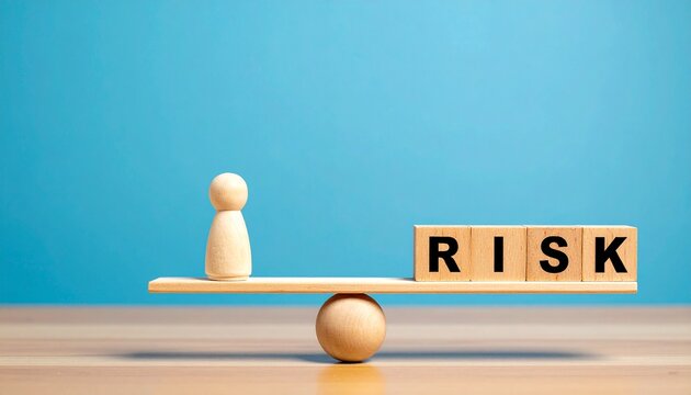 Risk Assessment Concept with Wooden Peg Doll and RISK Wooden Blocks Balanced on Seesaw Scale Over Solid Blue Background