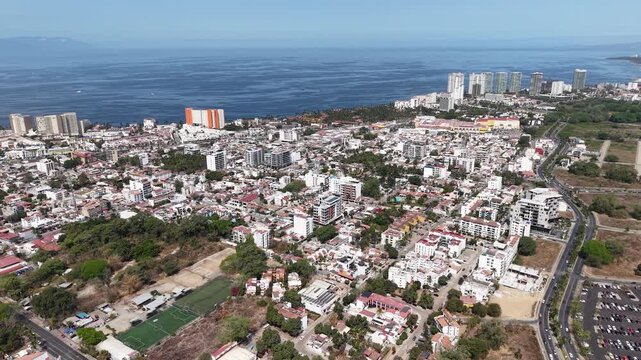 Aerial drone view of Versalles neighborhood in Puerto Vallarta with ocean in background