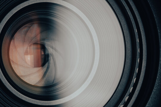 Close-up of camera lens aperture blades and optical elements,Macro,Detailed macro shot of a professional camera lens showing the mechanical aperture blades, iris diaphragm, and precision glass element