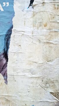 Torn and ripped urban paper poster background, messy paper, old urban texture timelapse