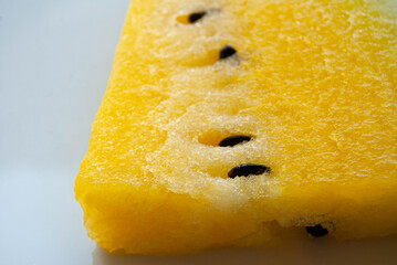 Macro view of ripe yellow watermelon with bright flesh and natural fruit texture. © Amina