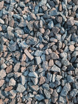 Full frame texture of crushed grey gravel stones background for construction
