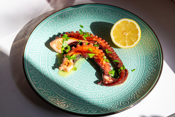Overhead View of Traditional Greek Grilled Octopus © ElenaEdelweys