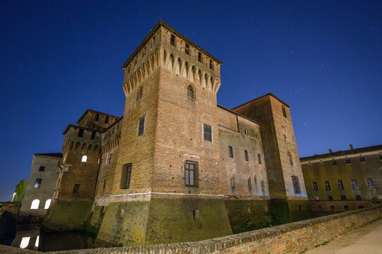 Towers of San Giorgio castle above the moat under a starry night sky, Mantua, Lombardy, Italy