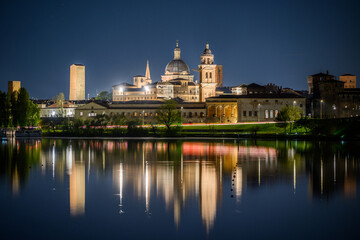 Illuminated night skyline of Mantua with domes and towers reflected in the lake, Lombardy, Italy © Michal Plevko