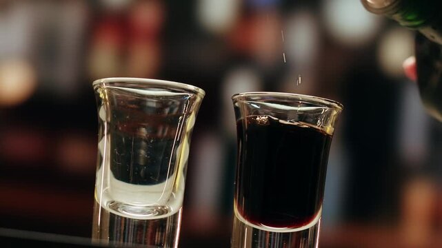 Pouring shot of red bitter, Cognac, whisky, Campari, Aperol, Cherry Vermouth Negroni, spanish wine drink, Alcoholic Americano Cocktail bitter, sweet vermouth and soda water, close up of making drink