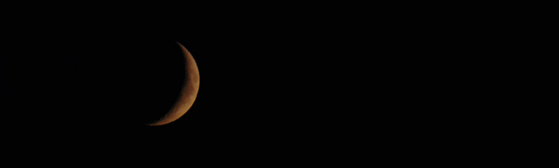 Waxing Crescent Moon in Dark Night Sky with Copy Space © Anton