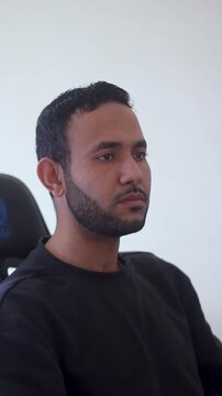 Young Software Developer or Designer Focused on Monitor Screen in Office