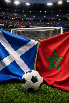 Scotland and Morocco national flags before a World Championship group stage football match on a green pitch with a goal in Foxborough.